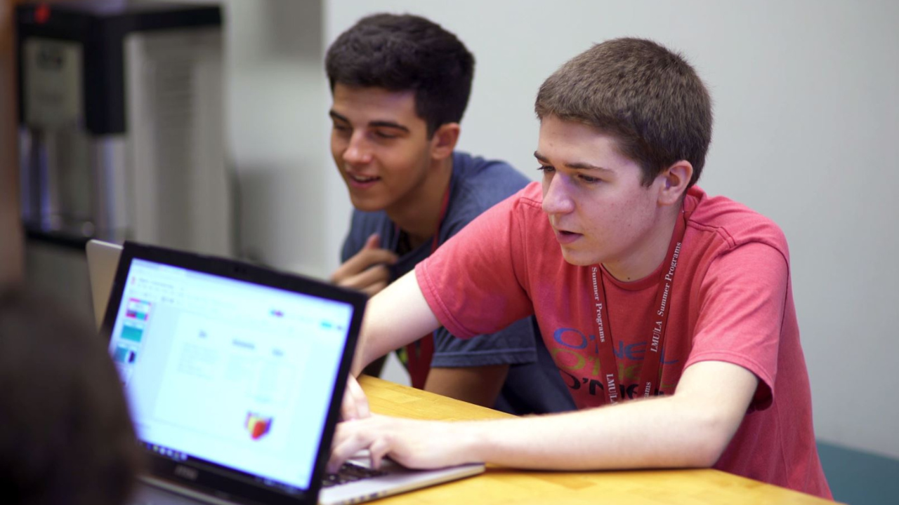 Two pre-college students work on an entrepreneurship project at LMU